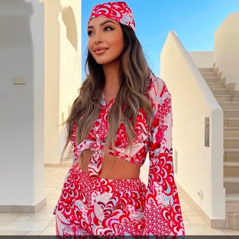 Red and White Patterned Outfit with Headscarf